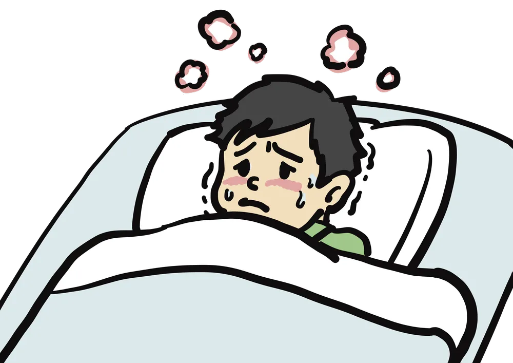 風邪をひいて布団で寝る少年のイラスト